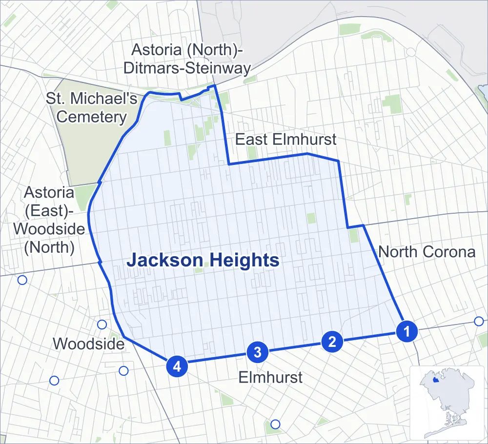 Street map of Jackson Heights, Queens, outlined among Elmhurst, East Elmhurst, North Corona and St. Michael's Cemetery, with its four subway stations and Travers Park.